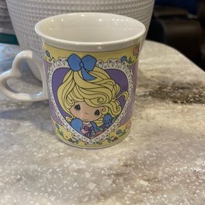 Precious Moments coffee cup.